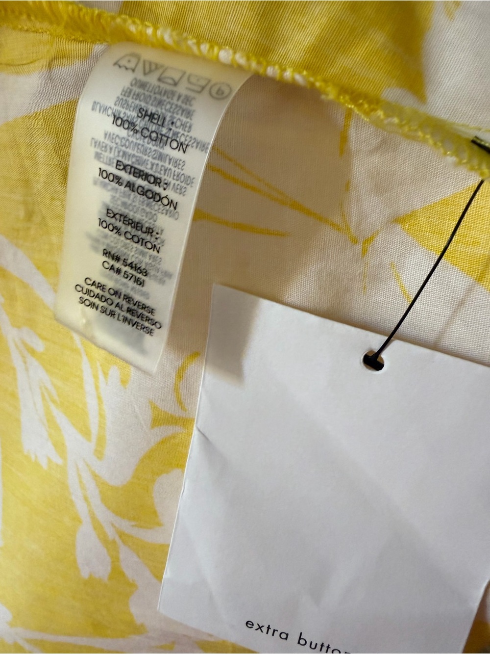 Calvin Klein Yellow & White Floral Midi Shirt Dress 
It has pockets on both side - Picture 3 of 3